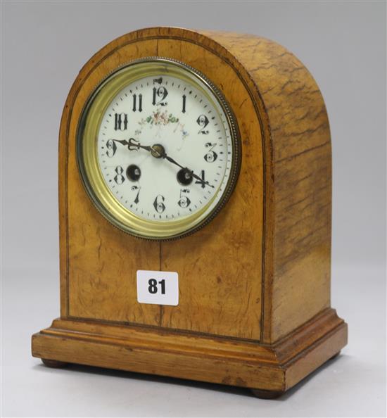 A Victorian satinwood mantel clock
